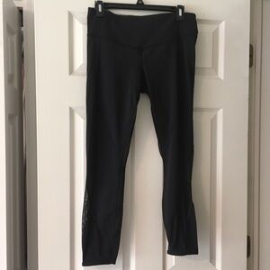 Lululemon black crop leggings with mesh cut out, size 8